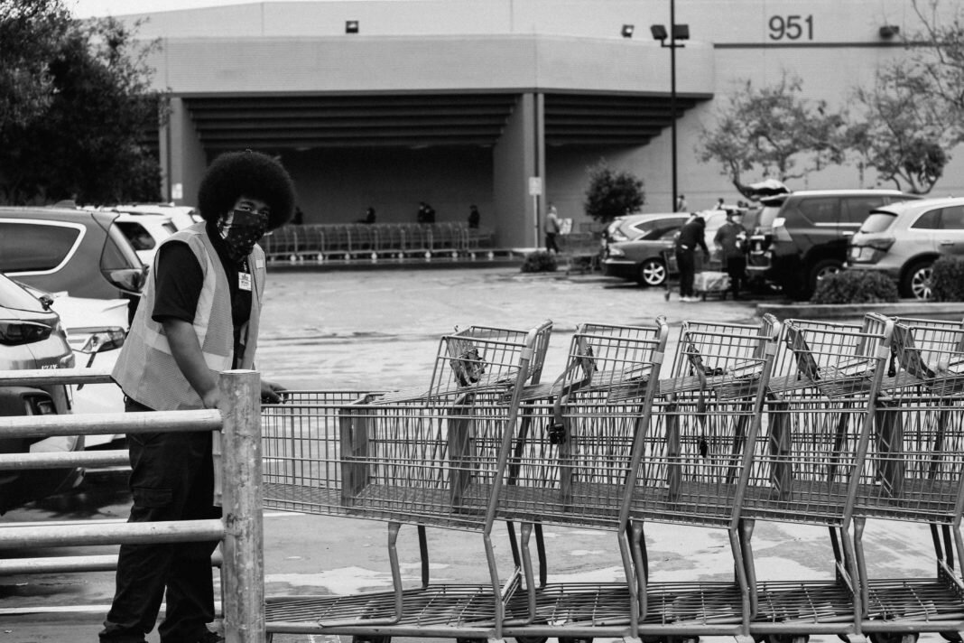 worker with grocery carts