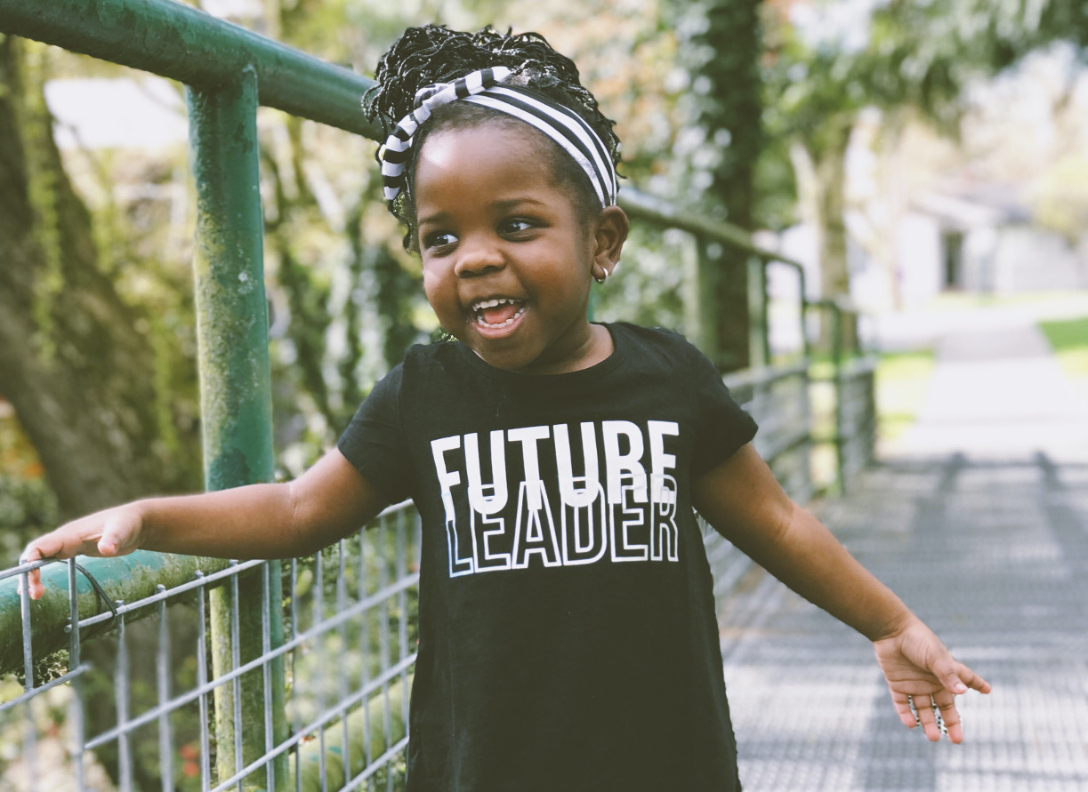 child with future leader shirt