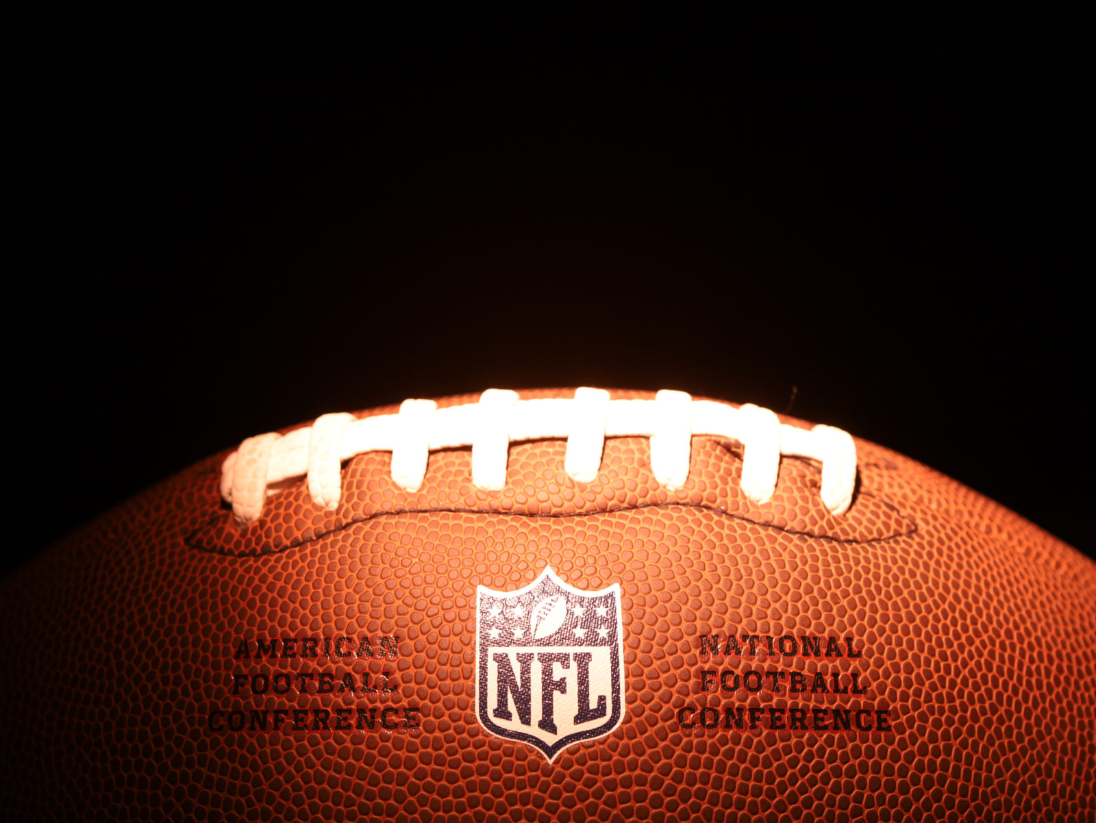 American football ball with emblem NFL. NATIONAL FOOTBALL LEAGUE. USA sports. Moscow, Russia - January 31, 2023. 2023/02/AdobeStock_566479530_Editorial_Use_Only.jpeg 
