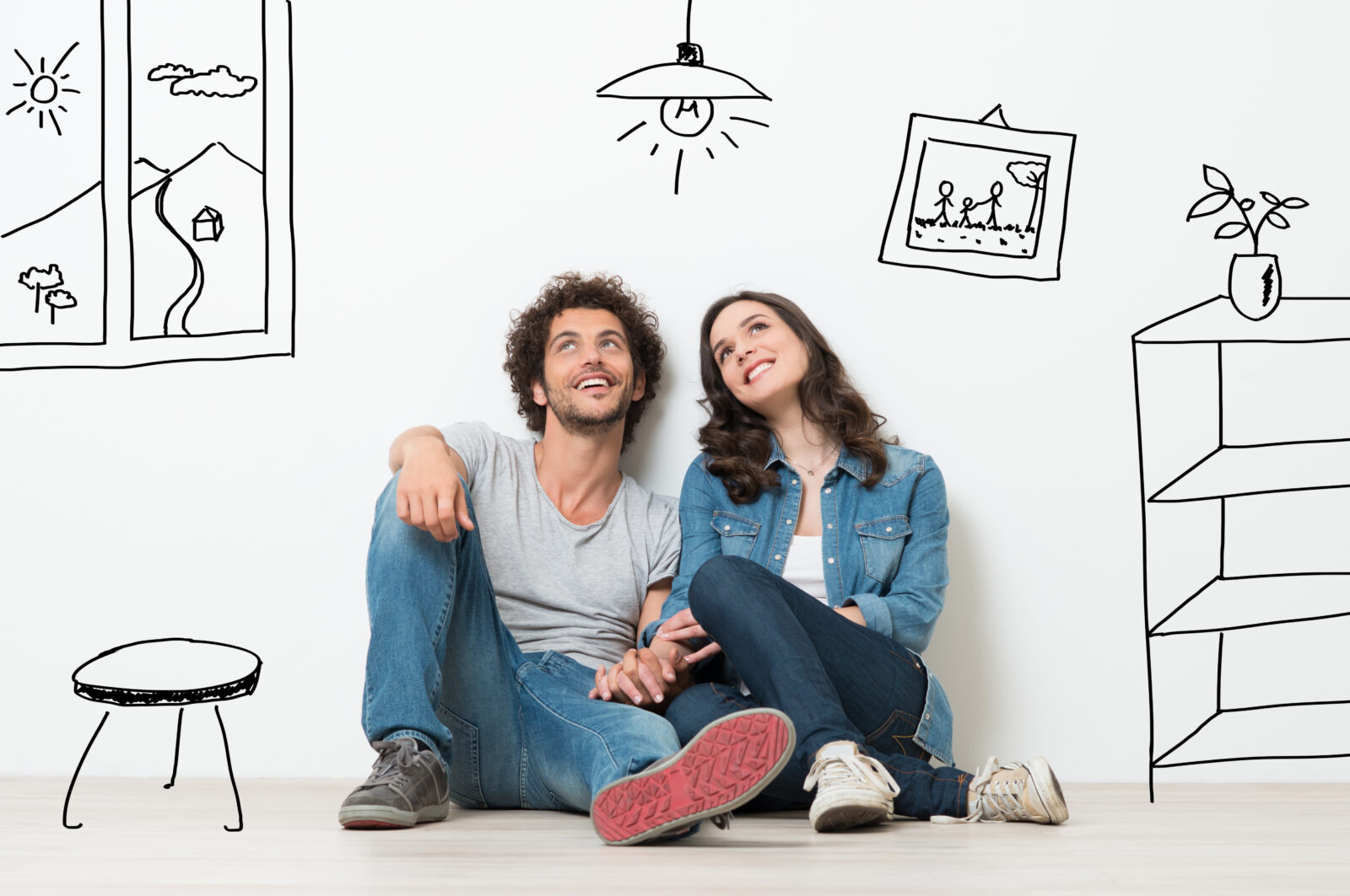 Portrait Of Happy Young Couple Sitting On Floor Looking Up While Dreaming Their New Home And Furnishing 2024/05/AdobeStock_67276977.jpeg 