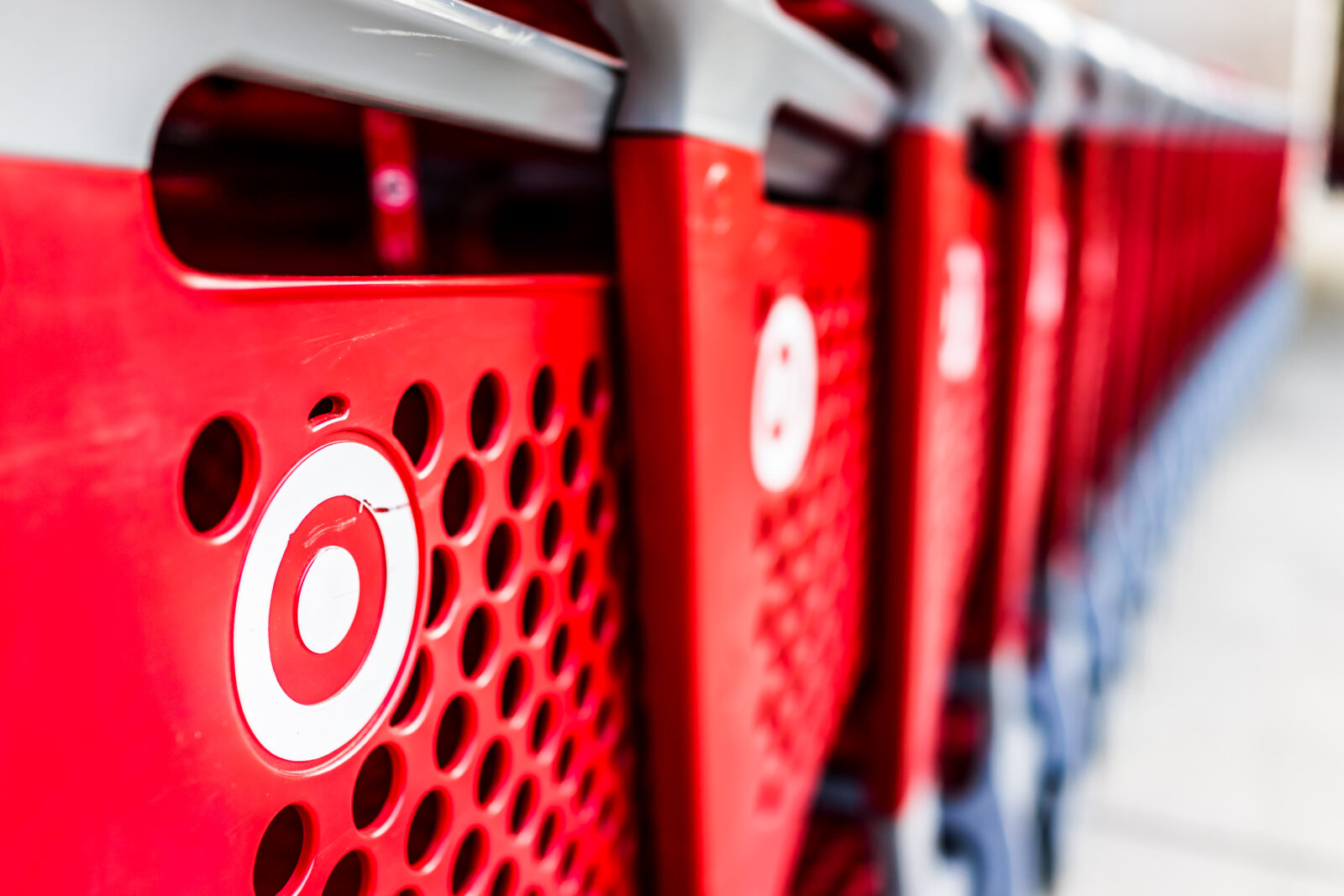 Fairfax, USA - September 21, 2017: Many rows of red shopping carts outside by store with closeup by Target store parking lot 2024/08/AdobeStock_302227604_Editorial_Use_Only.jpeg 