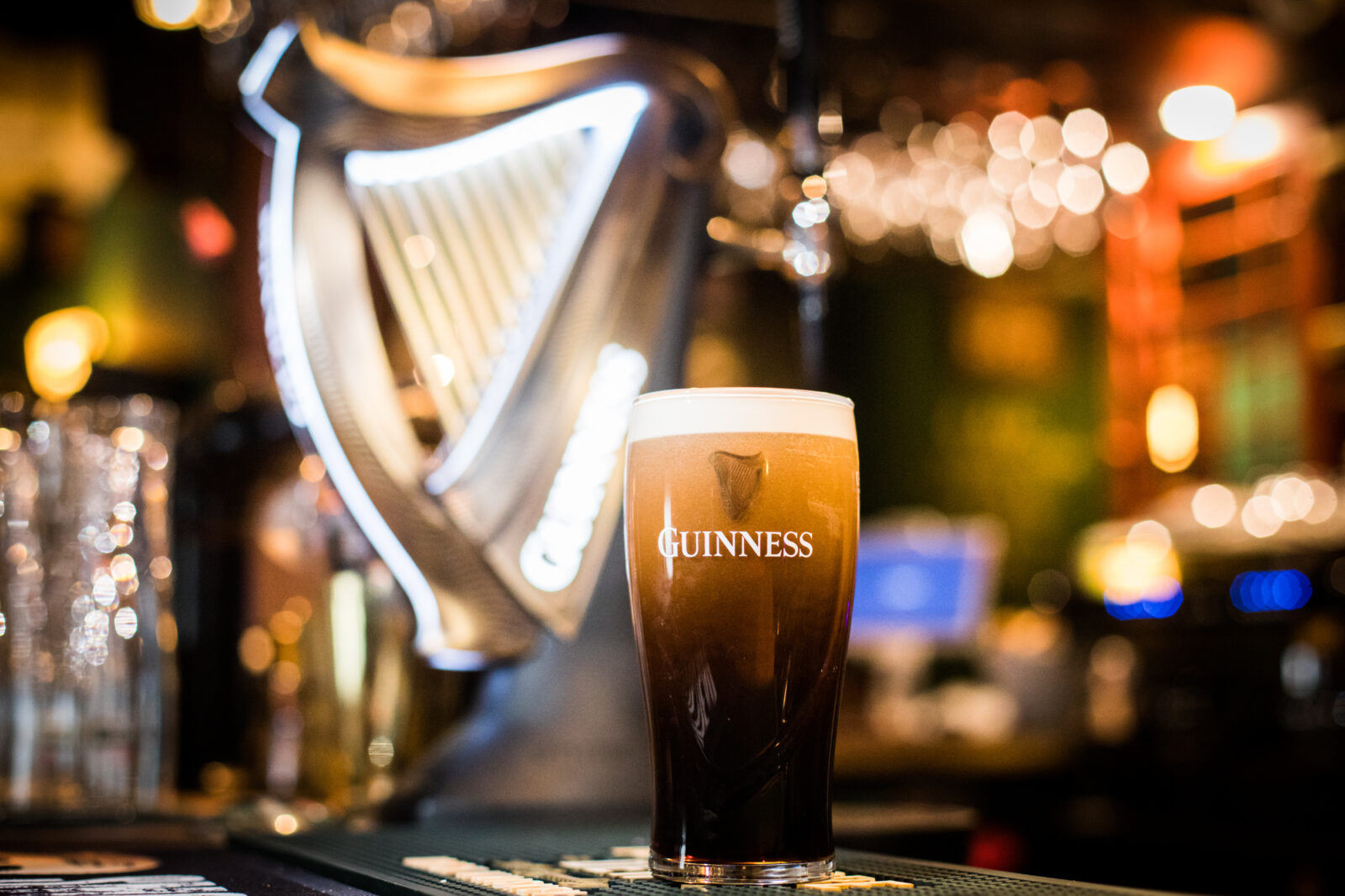 Bucharest, Romania - February 25, 2021: Illustrative editorial close up image of a pint of Guinness beer on a pub's counter. 2024/12/AdobeStock_418928473_Editorial_Use_Only.jpeg 