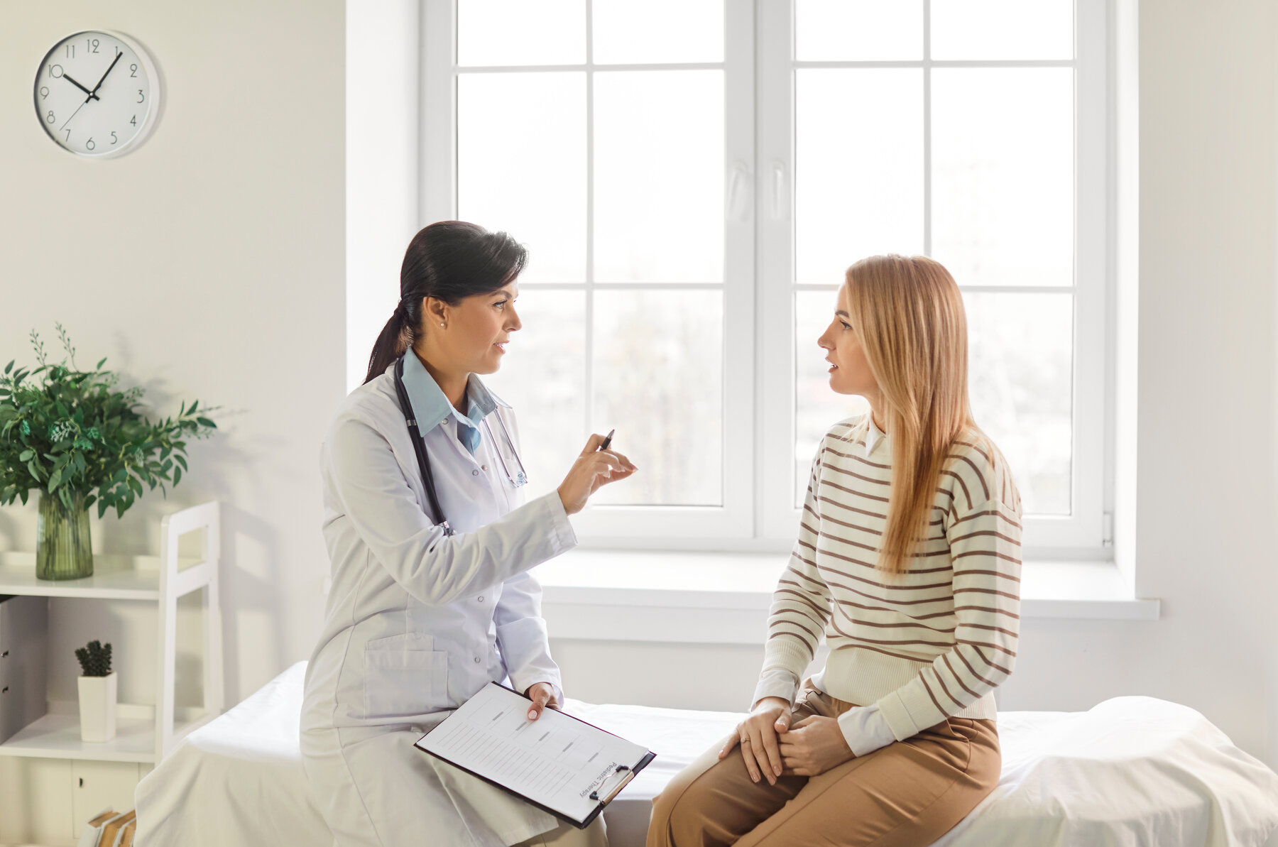 Woman talking to a doctor in a clinic