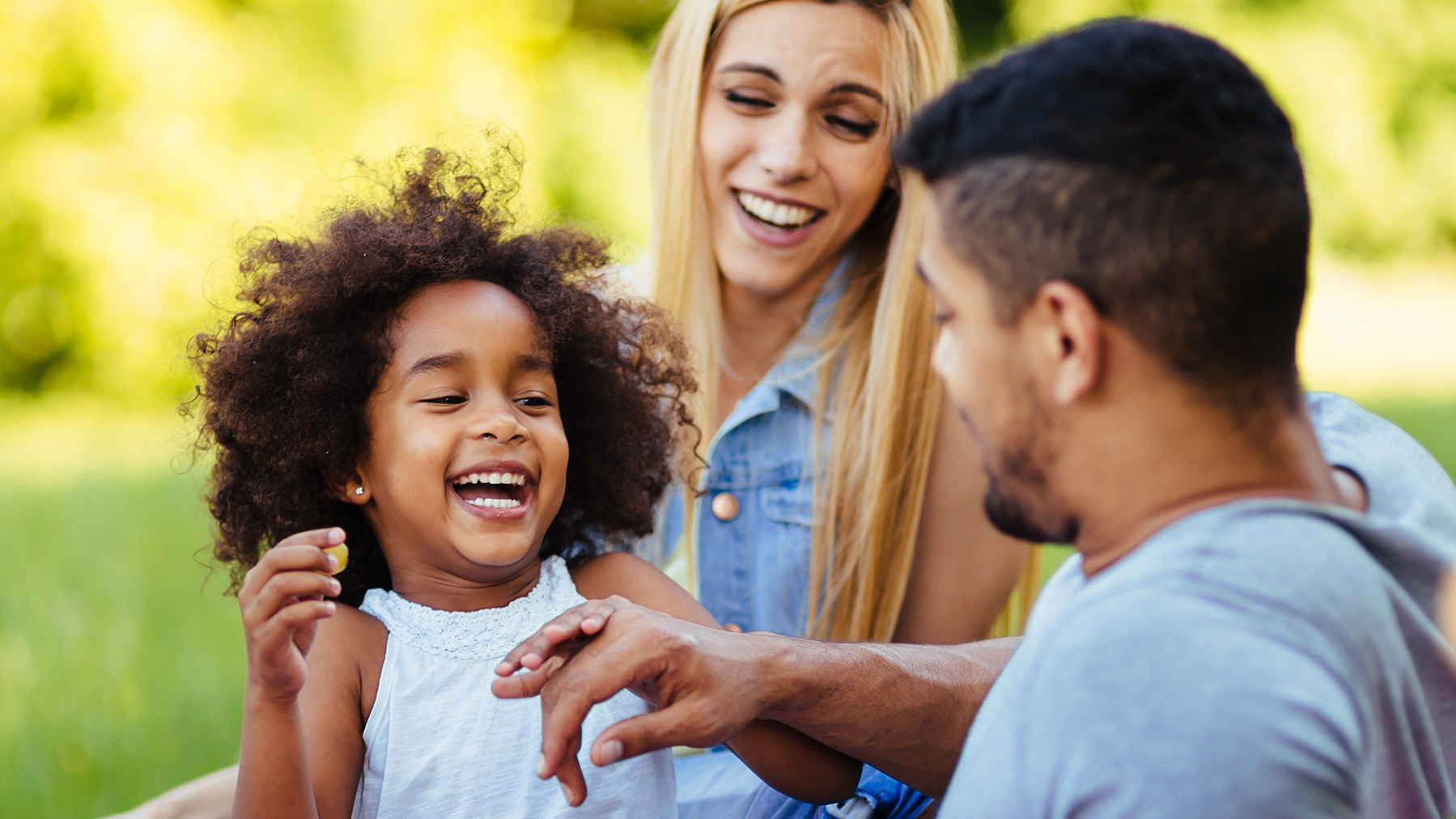 Happy family is enjoying a day in the park