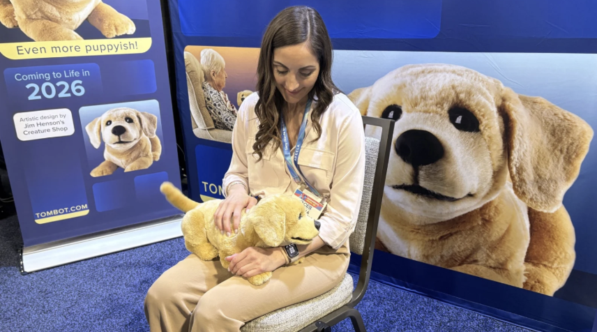 Woman holding puppy on her lap