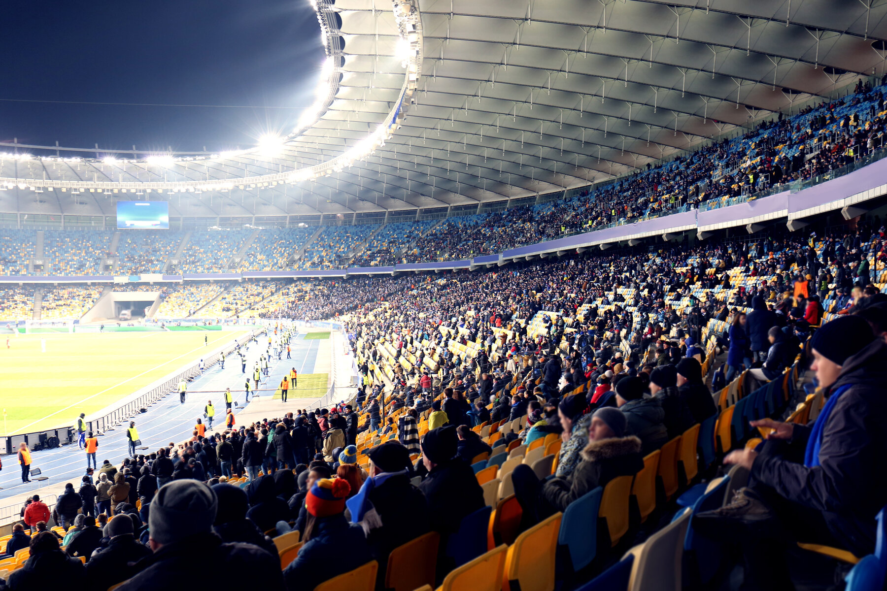Fans watching football game at stadium