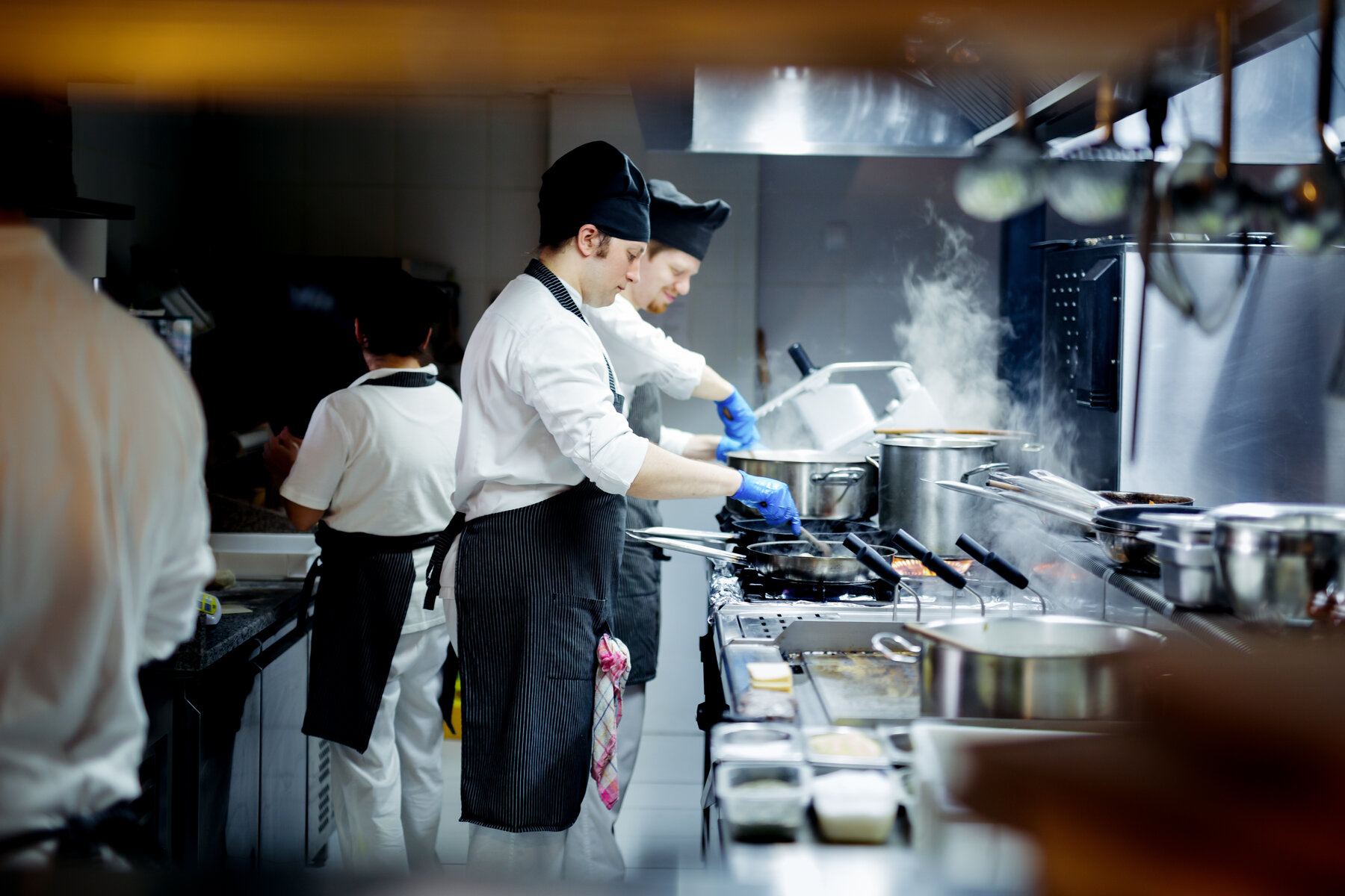 Two chefs cooking in a kitchen