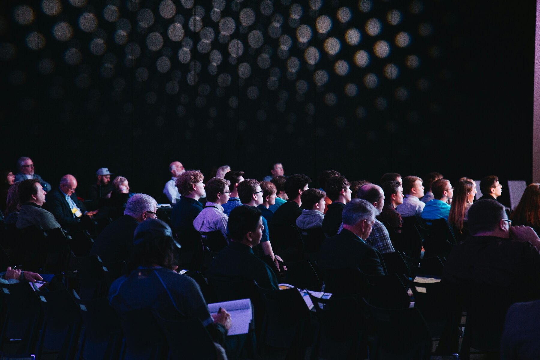 People listening in a crowd